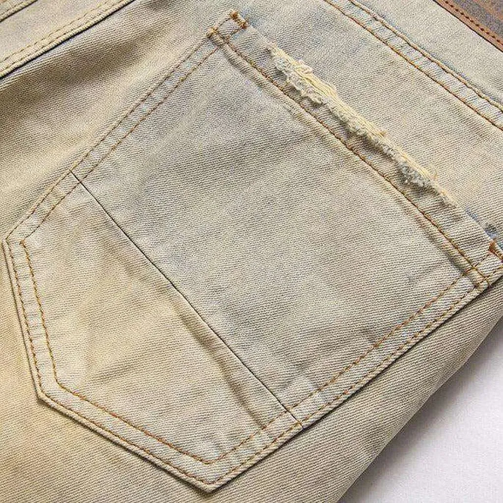 Distressed men's jeans with zippers