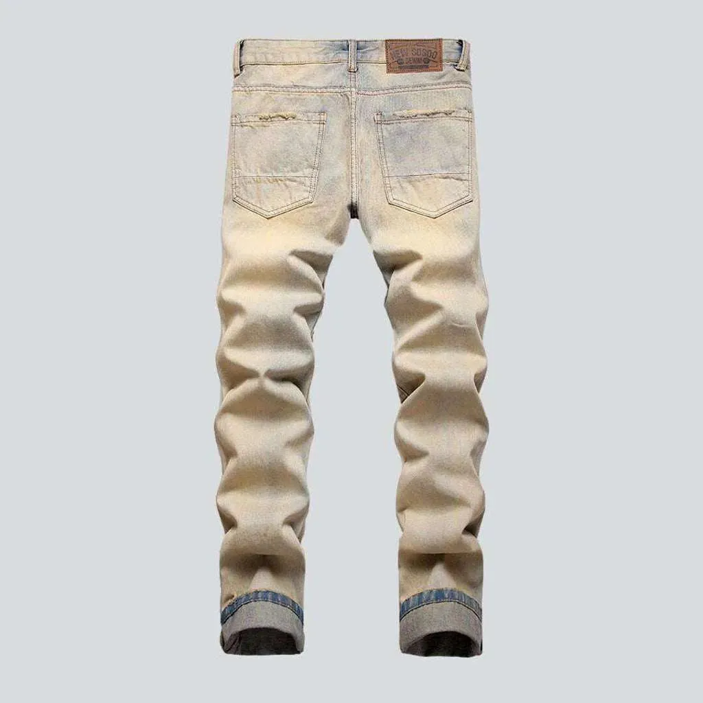 Distressed men's jeans with zippers