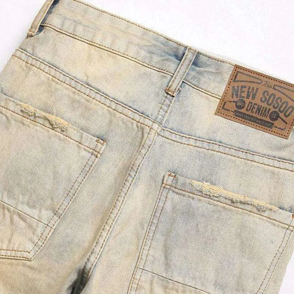 Distressed men's jeans with zippers