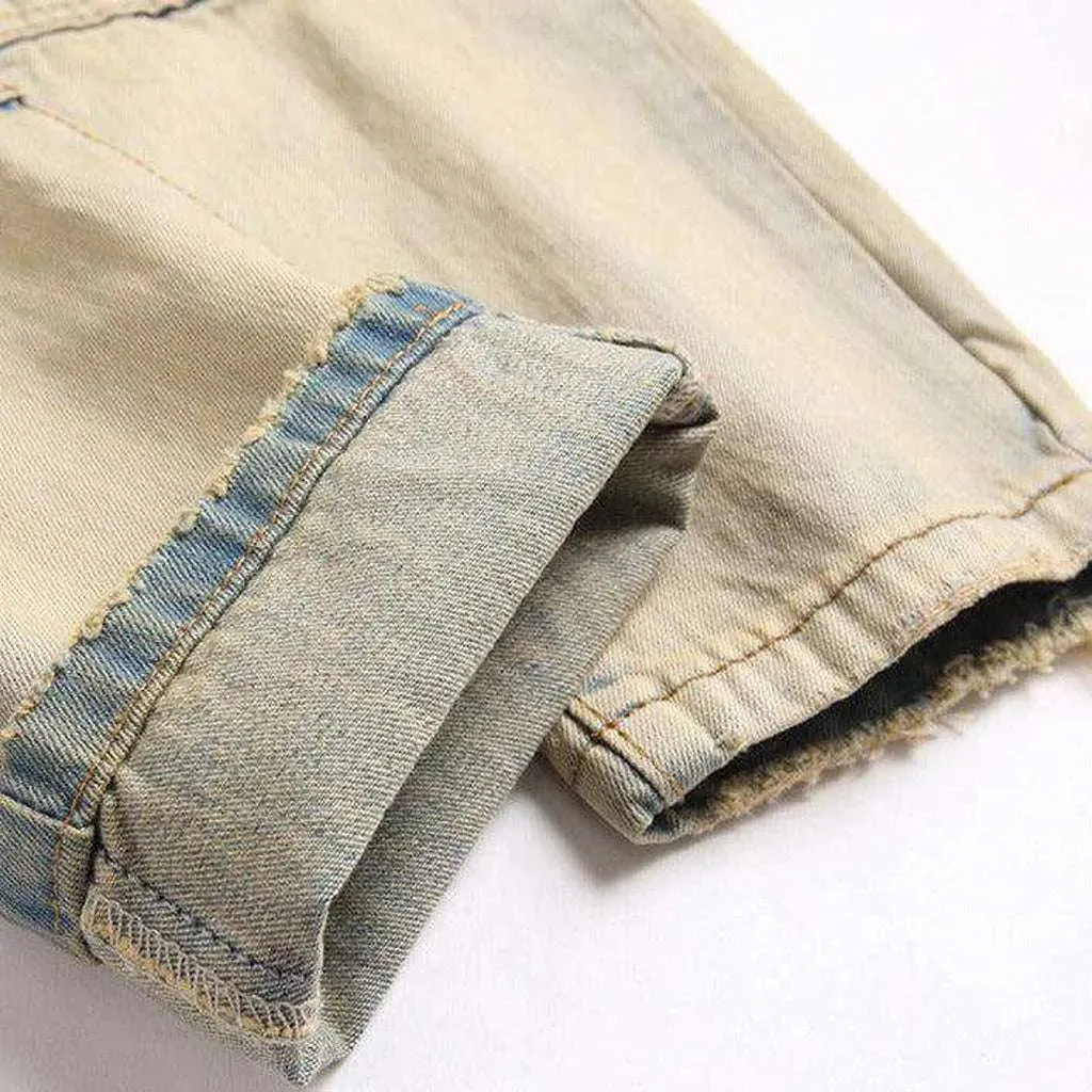 Distressed men's jeans with zippers