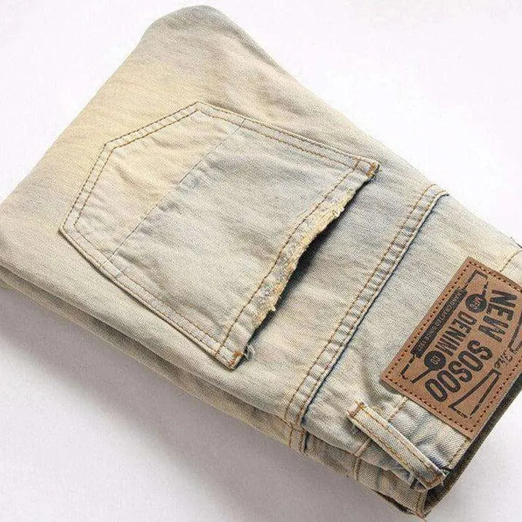 Distressed men's jeans with zippers